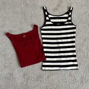 Two XS Loft tank tops in merlot color and black/cream stripes